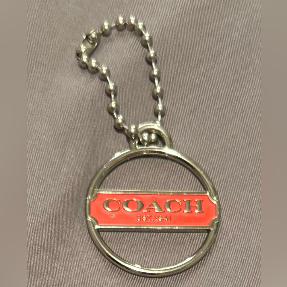 Coach Silver and Coral Round Logo Pendant Hang Tag